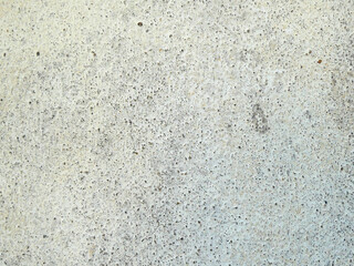 Ancient stone walls, brown and very old, with painted patterns on the surface.