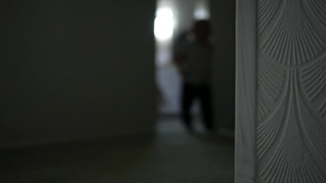 Blurry Toddler Runs Down De-focused Hallway In Home