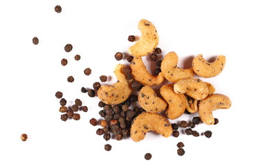 Spicy cashews nuts with black pepper isolated on white, top view