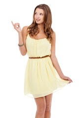 Fototapeta premium Woman, pointing up and advertising promo with fashion model in yellow dress isolated on transparent, png background. Presentation, summer deal with young female and boutique sale announcement