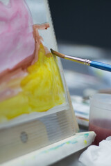 brush while painting close-up
