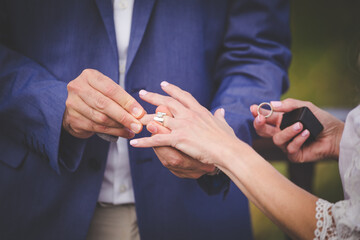 Intimate Moment of a couple Exchanging Wedding Rings at a wedding