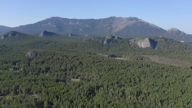 Aerial drone footage of rock remnant near the Lake Great Chebachye Lake in Natonal park Burabay Borovoe , Kazakhstan