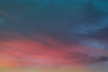 Pink sky and clouds background at dusk.