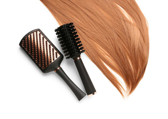 Ginger hair with brushes on white background