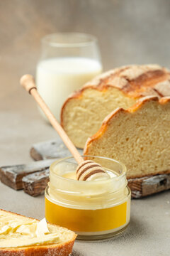 Delicious breakfast or snack Bread and honey, milk, vertical image. top view. place for text