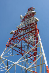Telecommunication tower against blue sky