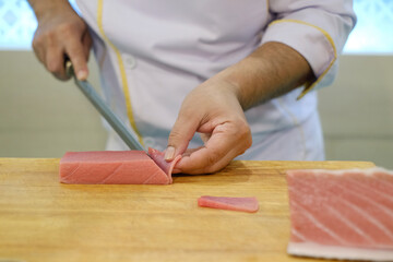 chef cutting meat