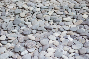 Small stones texture background, white background pebbles, simplicity. textured background of stones.