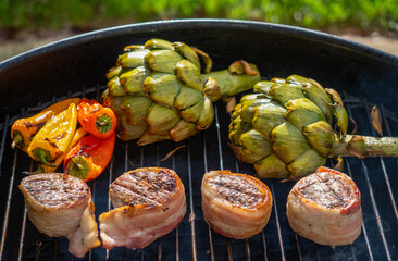 Grilling meat and vegetables on a bbq grill 