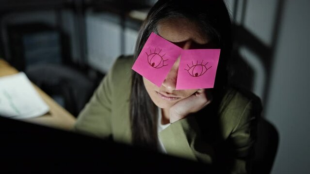 Young beautiful hispanic woman business worker tired with reminders covering eyes at office