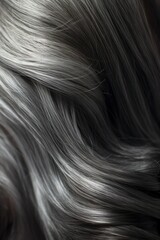 A closeup view of a bunch of shiny straight gray hair in a wavy curved style. Generative AI