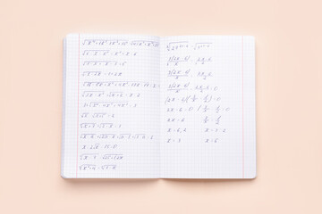 Copybook with maths formulas on beige background
