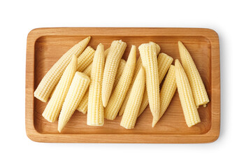 Wooden board of tasty canned corn cobs on white background