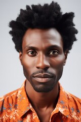 Obraz premium Afro young adult man portrait over white background. Generative AI vertical shot