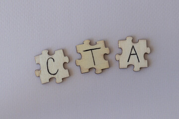 Obraz premium The acronym CTA, which stands for Call To Action. The letters written on the puzzles.