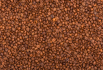 Texture from scattered roasted coffee beans.