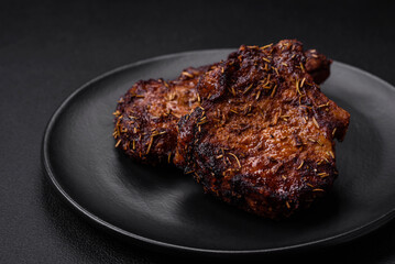 Delicious beef or pork steak on the bone grilled with spices and rosemary