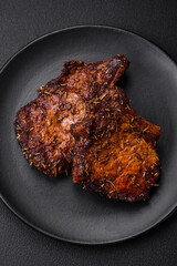 Delicious beef or pork steak on the bone grilled with spices and rosemary
