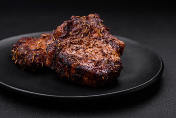 Delicious beef or pork steak on the bone grilled with spices and rosemary