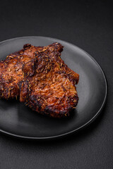 Delicious beef or pork steak on the bone grilled with spices and rosemary