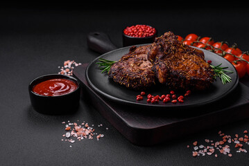 Delicious beef or pork steak on the bone grilled with spices and rosemary