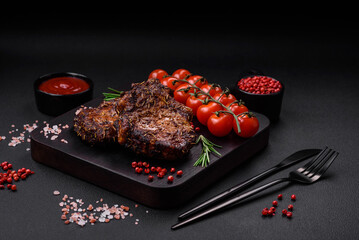 Delicious beef or pork steak on the bone grilled with spices and rosemary