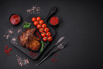 Delicious beef or pork steak on the bone grilled with spices and rosemary