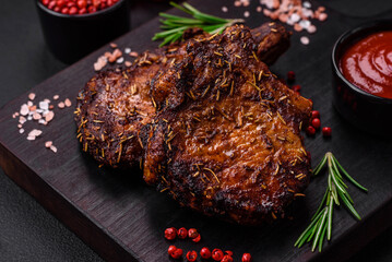 Delicious beef or pork steak on the bone grilled with spices and rosemary