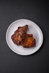 Delicious beef or pork steak on the bone grilled with spices and rosemary