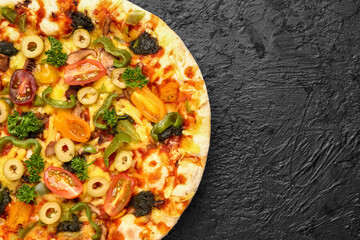 Vegetable pizza on dark background