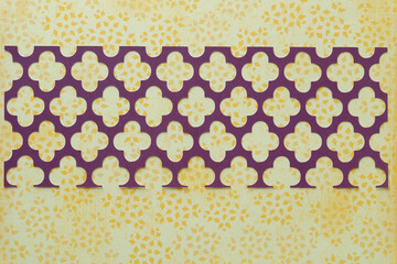 machine cut decorative scrapbook paper grid or screen on yellow paper