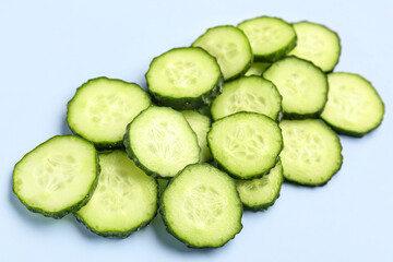 Slices of cucumber on blue background