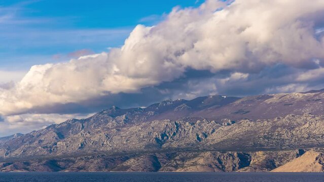 Timelapse of the clouds over Velebit mountain, seen from Pag, Croatia