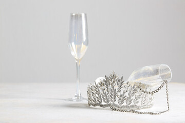 Beautiful tiara, glasses and necklace on white table. Prom concept © Pixel-Shot