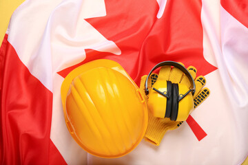 Builder's tools on flag of Canada, closeup