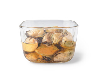 Marinated mussels in glass bowl on white background