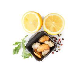 Marinated mussels in square bowl with lemon halves, parsley and peppercorn on white background