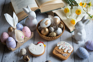 A cup of hot coffee on a festive Easter table with colored eggs.