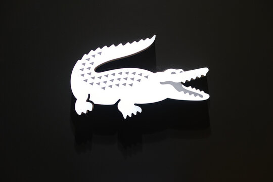 BANGKOK, THAILAND - CIRCA APRIL, 2023: close up shot of Lacoste sign as seen at the store in Siam Discovery shopping center.