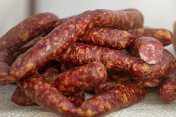 Fresh smoked sausage in the store. Choice of smoked meat products. Selection of sausages in the store.