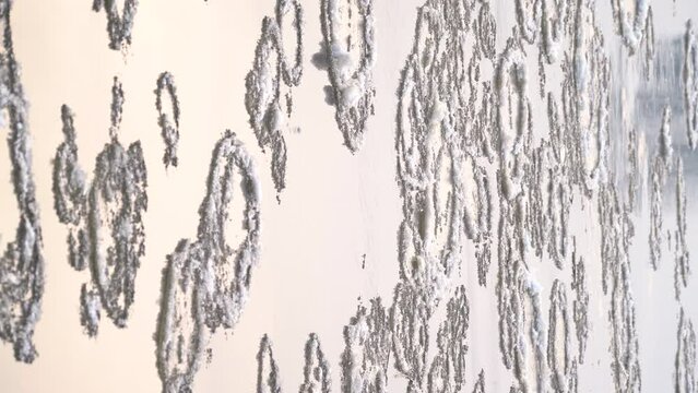 Beautiful view on river water surface with flowing circle ice, vertical video.
