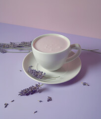 Cup of lavender latte, minimalistic background