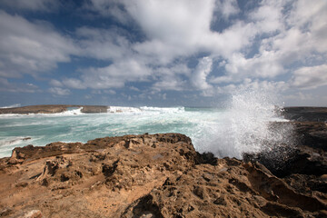 Spray from storm waves crashing into Laie Point coastline at Kaawa on the North Shore of Oahu Hawaii United States