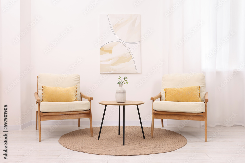 Wall mural stylish armchairs and wooden table in living room. interior design - Wall murals
