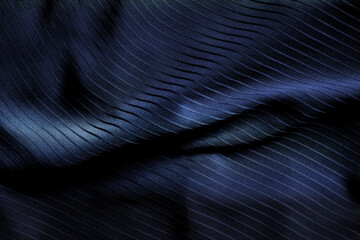 Dark black and gray blurred gradient and line of cloth or fablic background has a little abstract light.