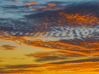 Fototapeta premium Sunrise cloudscape in shades of purple and orange