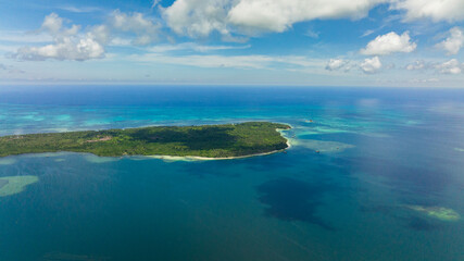 Fototapeta na wymiar Tropical island with jungle and blue sea. Seascape in the tropics. Balabac, Palawan. Philippines.