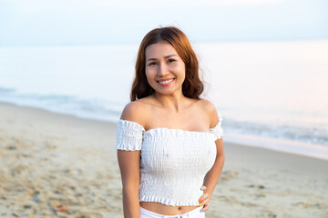 Fototapeta na wymiar Attractive Asian woman in bikini on tropical summer beach