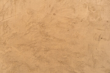 old brown retro wall or empty yellow loft background and golden cement table on top view to vintage concrete texture floor for home interior rough decor or exterior to pattern backdrop wallpaper